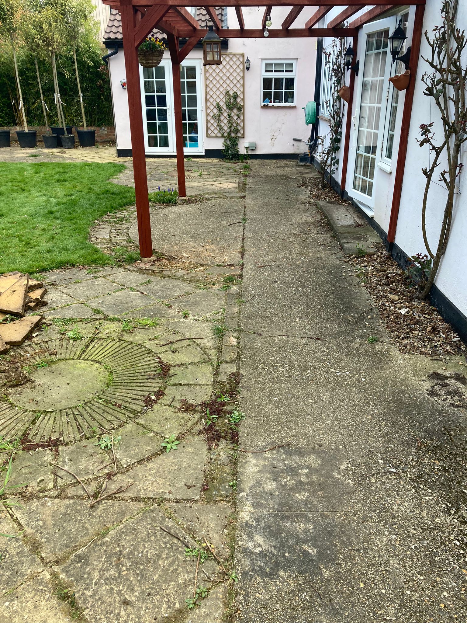 Indian sandstone patio replaced this old paving